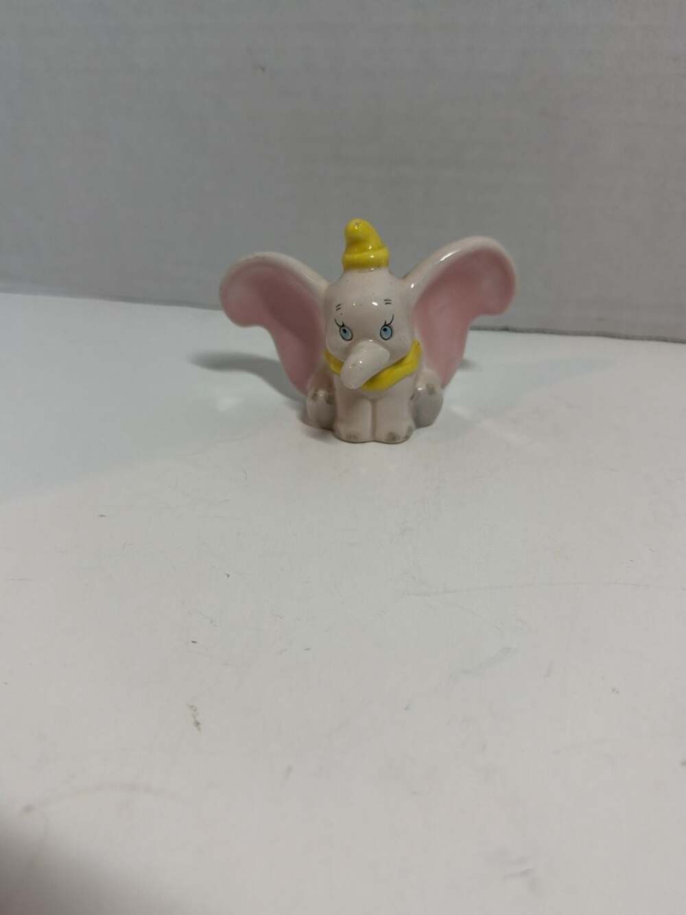 Vintage Disney Dumbo Ceramic Figurine with Yellow Hat and Collar